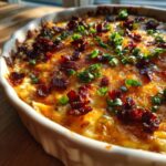 Hot, bubbly baked cream cheese dip topped with crispy bacon bits and fresh green onions.
