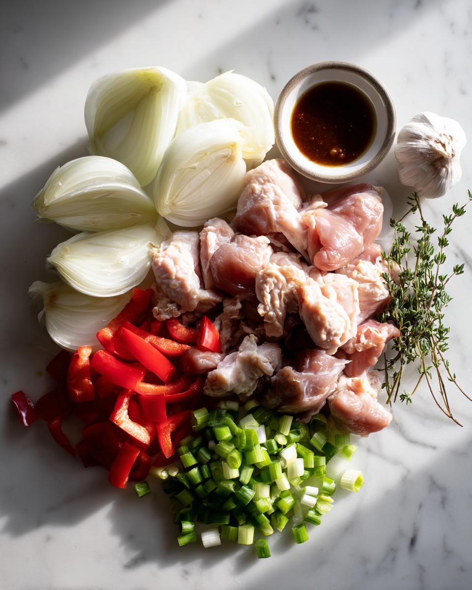 Raw ingredients including chopped chicken, onions, peppers, and scallions for making brown stew chicken jamaican crock pot.